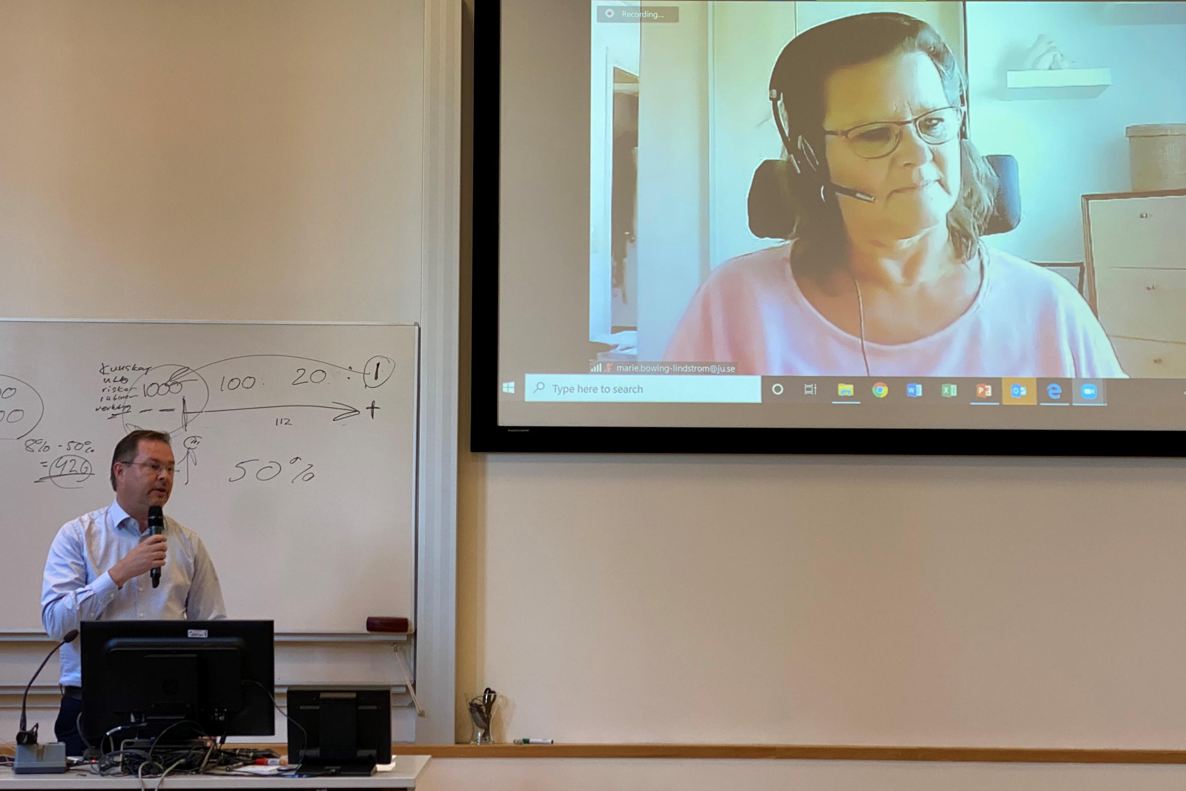 Karl Hedman presenting and on the screen is Marie Böwing-Lindström from the Student Health Care.