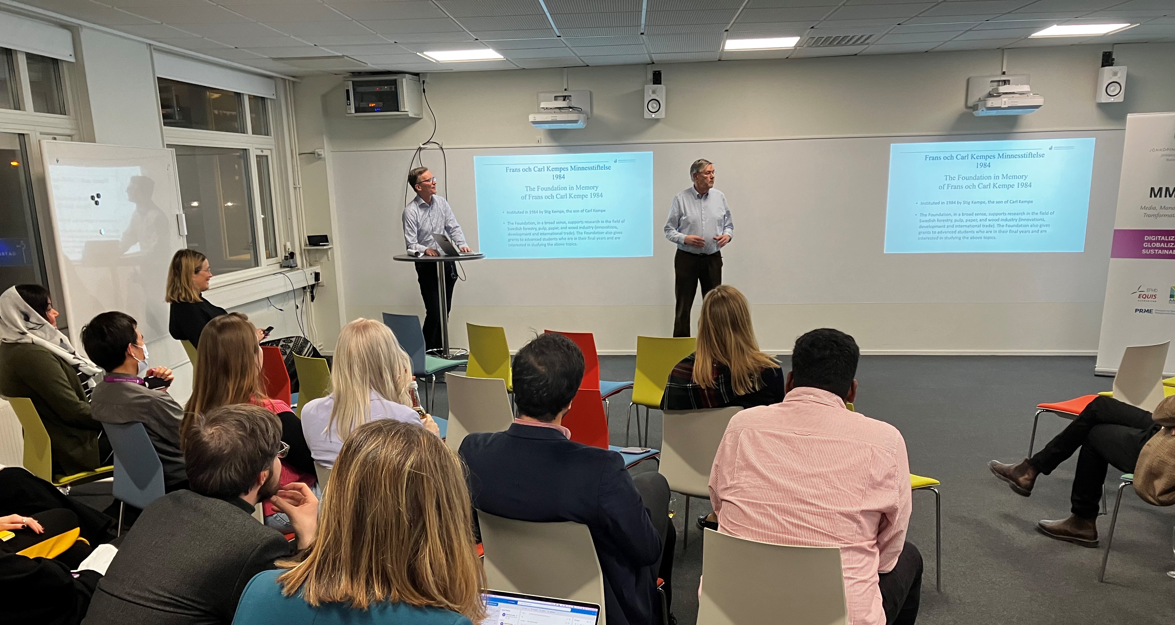 Two men presenting to audience